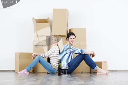 Image of Young couple moving in new house