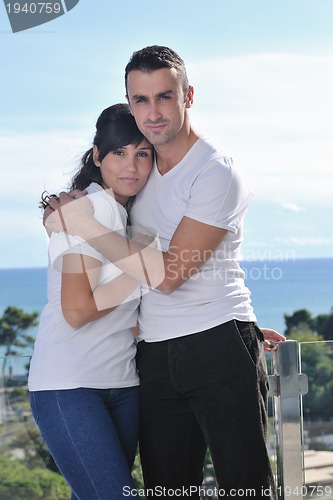 Image of couple relaxing on balcony
