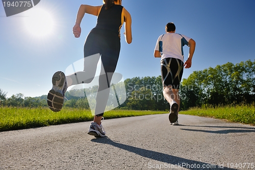 Image of Young couple jogging