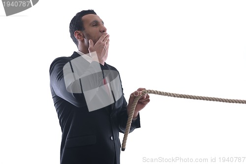 Image of business man with rope isolated on white background