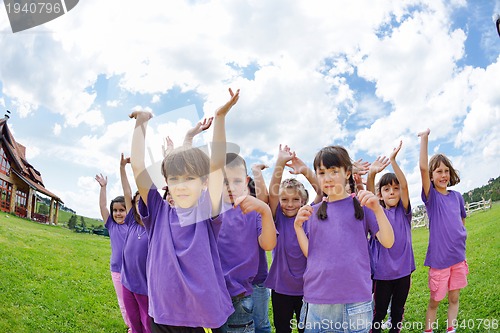 Image of happy kids group  have fun in nature