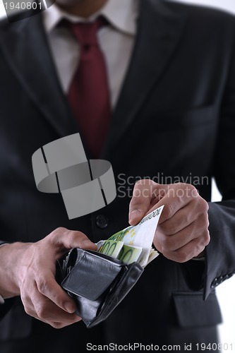 Image of Business man holding money