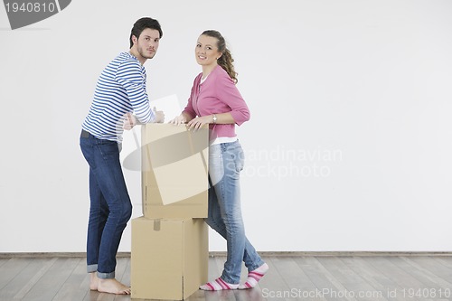 Image of Young couple moving in new home