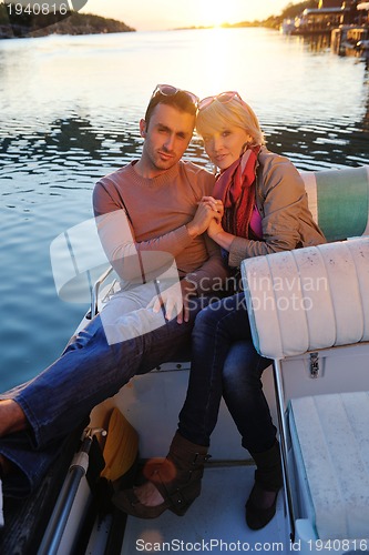 Image of couple in love  have romantic time on boat