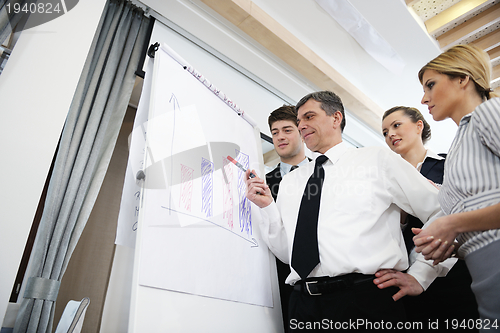 Image of Senior business man giving a presentation
