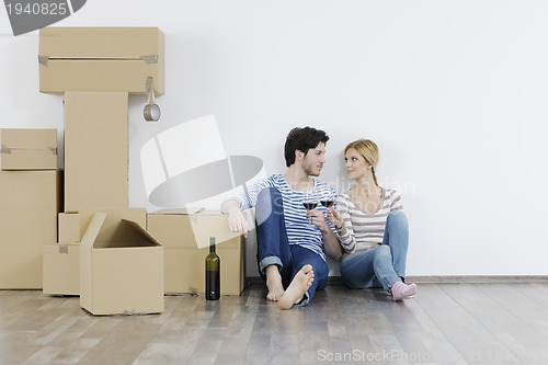 Image of Young couple moving in new home
