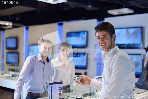 Image of people buy  in consumer electronics store