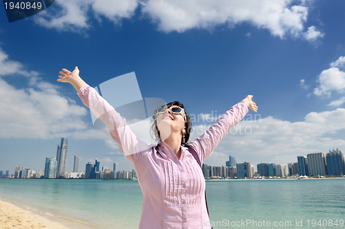 Image of happy tourist woman