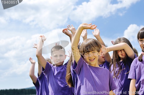 Image of happy kids group  have fun in nature