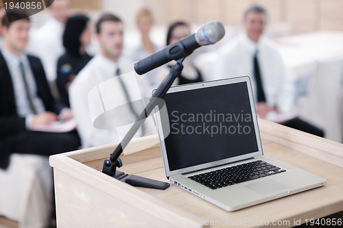 Image of laptop on conference speech podium