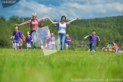 Image of happy kids group  have fun in nature