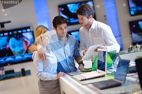 Image of people buy  in consumer electronics store