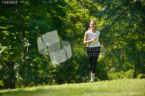 Image of Young couple jogging