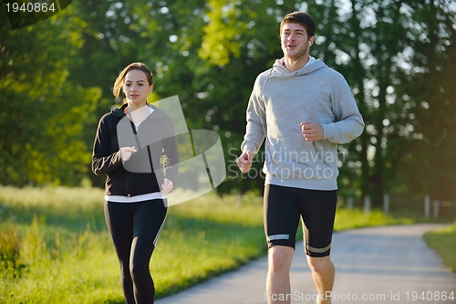 Image of Young couple jogging