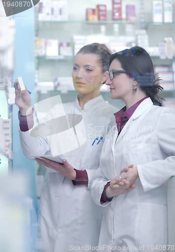 Image of team of pharmacist chemist woman  in pharmacy drugstore