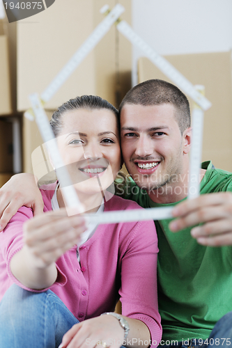 Image of Young couple moving in new house