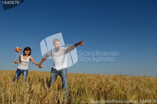 Image of happy couple in wheat field