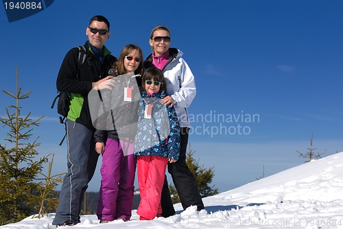 Image of portrait of happy young family at winter