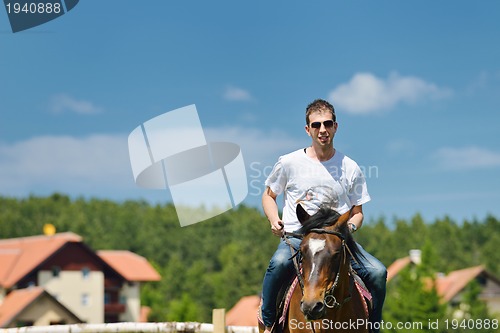 Image of man ride horse