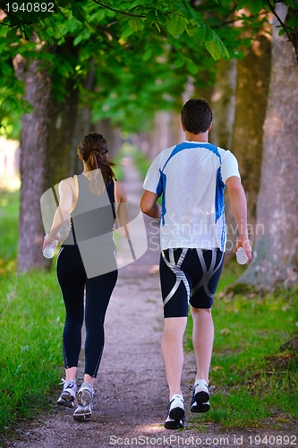 Image of Young couple jogging