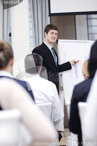 Image of Young  business man giving a presentation on conference