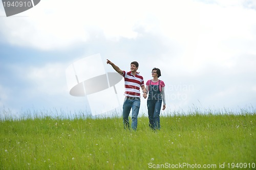 Image of romantic young couple in love together outdoor