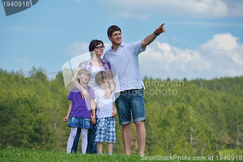 Image of happy young family have fun outdoors