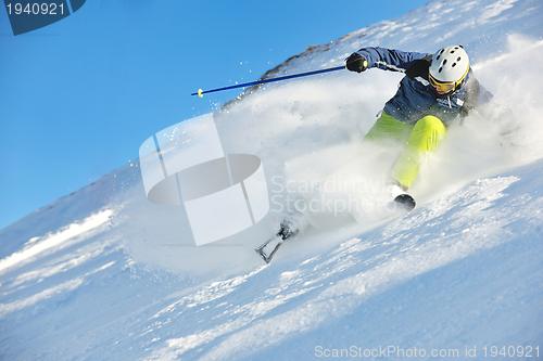 Image of skiing on fresh snow at winter season at beautiful sunny day