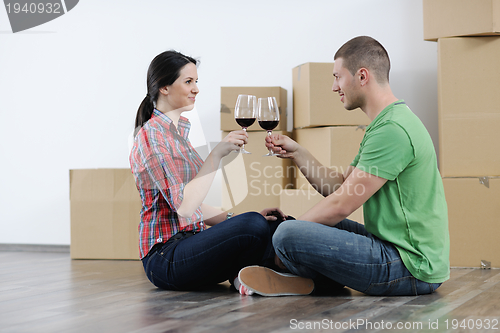 Image of Young couple moving in new house