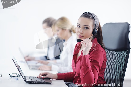 Image of business woman group with headphones