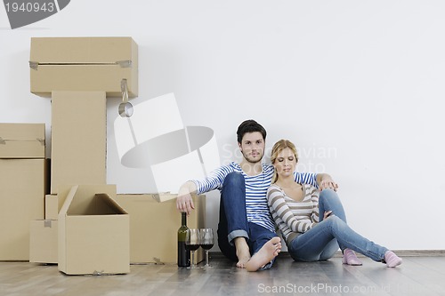 Image of Young couple moving in new home