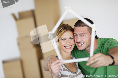 Image of Young couple moving in new house