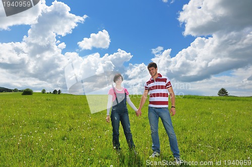Image of romantic young couple in love together outdoor