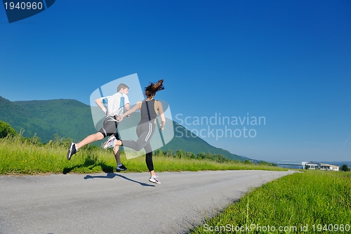 Image of Young couple jogging