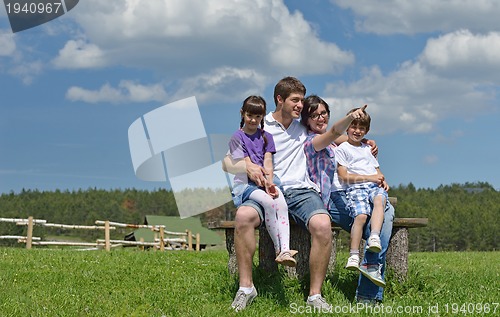 Image of happy young family have fun outdoors