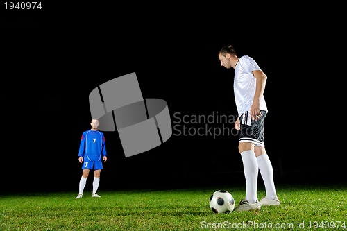 Image of football players in action for the ball