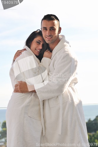 Image of couple relaxing on balcony
