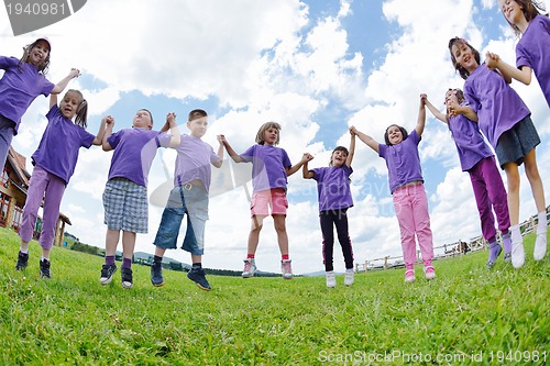 Image of happy kids group  have fun in nature