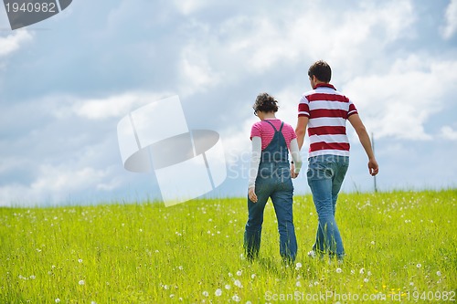 Image of romantic young couple in love together outdoor