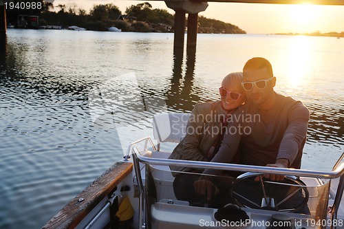 Image of couple in love  have romantic time on boat