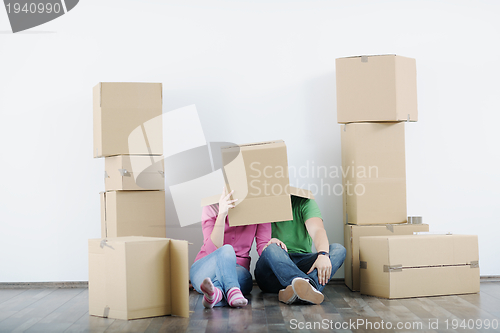 Image of Young couple moving in new house