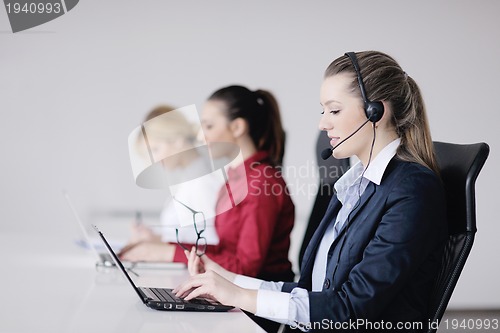 Image of business woman group with headphones