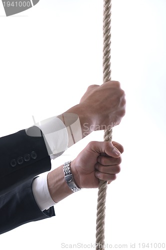 Image of business man with rope isolated on white background