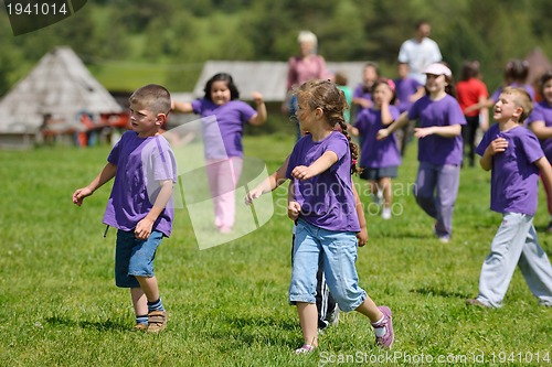 Image of happy kids group  have fun in nature