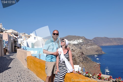 Image of happy young couple tourists in greece