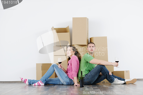 Image of Young couple moving in new house