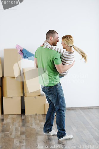 Image of Young couple moving in new house