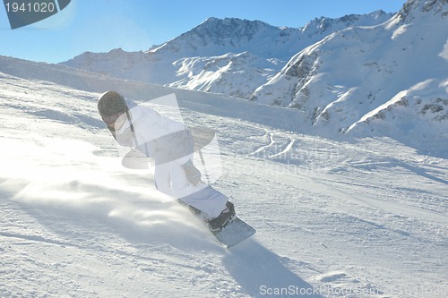 Image of skiing on fresh snow at winter season at beautiful sunny day