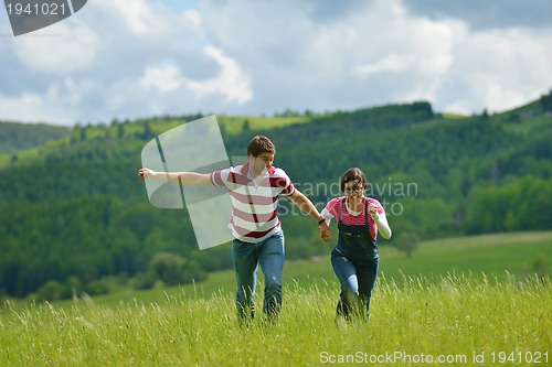 Image of romantic young couple in love together outdoor