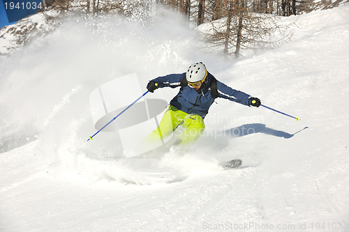 Image of skiing on fresh snow at winter season at beautiful sunny day